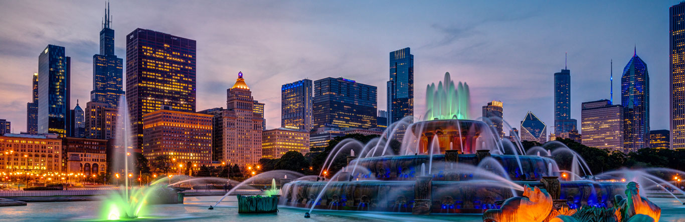 city skyline behind fountain